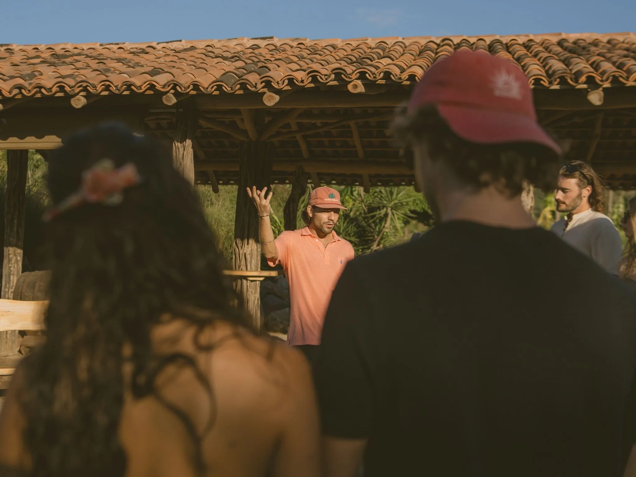 Guide welcoming guests at the Cachashade Bar before the distillery tour, Cachasol Farm Distillery near Punta Mita