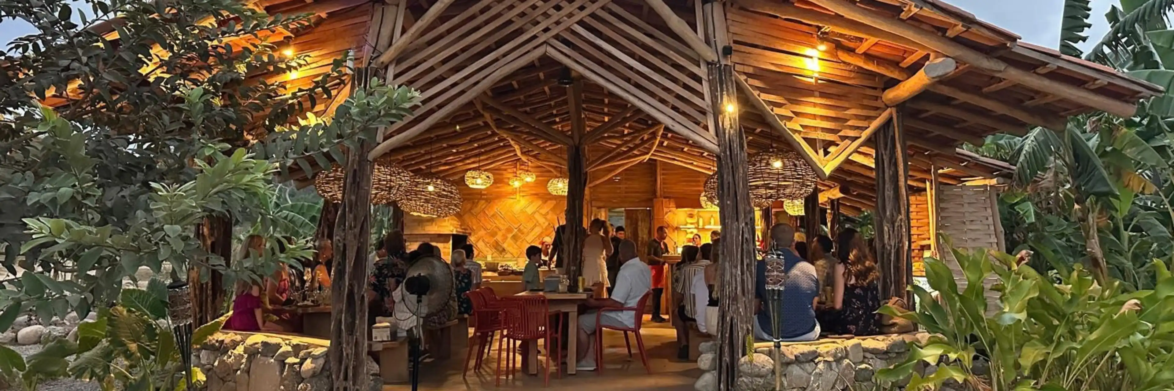 The comedor at Cachasol Farm Distillery glowing at dusk, Sayulita, Nayarit
